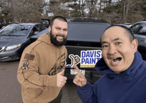 Colby and me giving thumbs up in front of a Davis Painting truck.